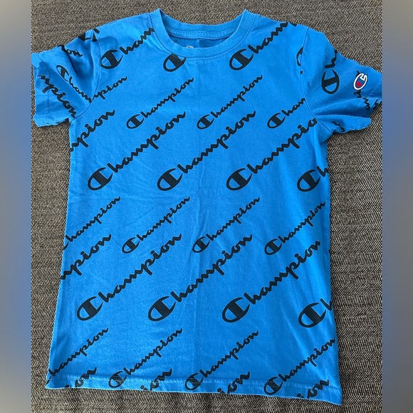 Champion Other - Blue Champion shirt with wording covering front and back of the shirt